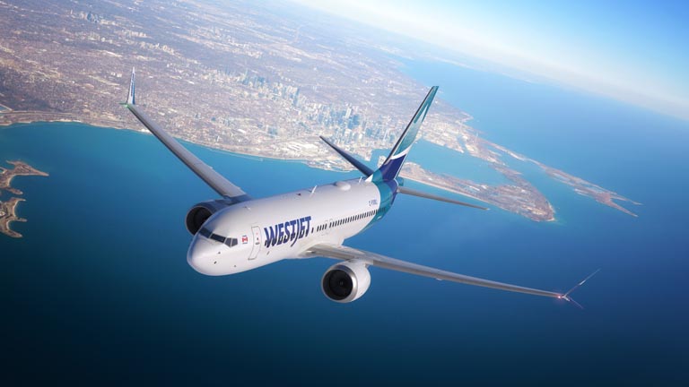 WestJet Boeing MAX 8 aircraft flying over Toronto Canada