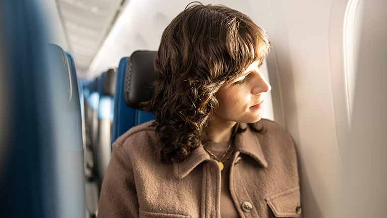 Woman sitting on plane