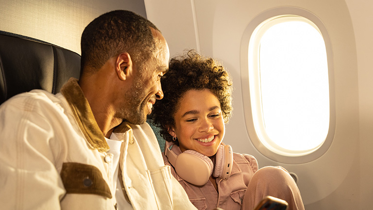 A father and daughter in Premium relaxing togetherA father and daughter in Premium relaxing together