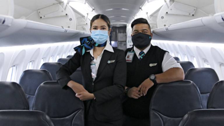 WestJet customer service agent wearing a mask
