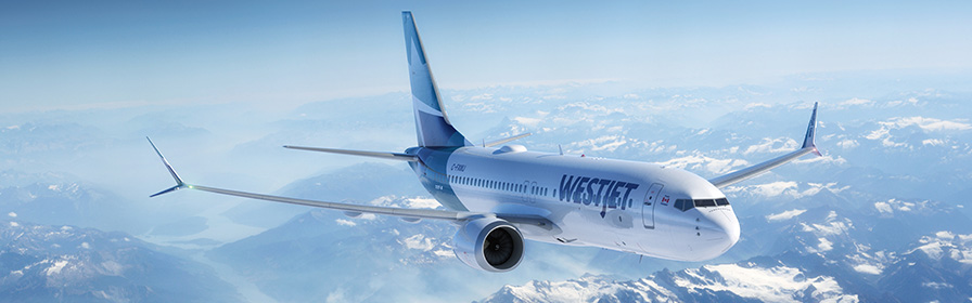 WestJet MAX 8 flying over Rocky Mountains
