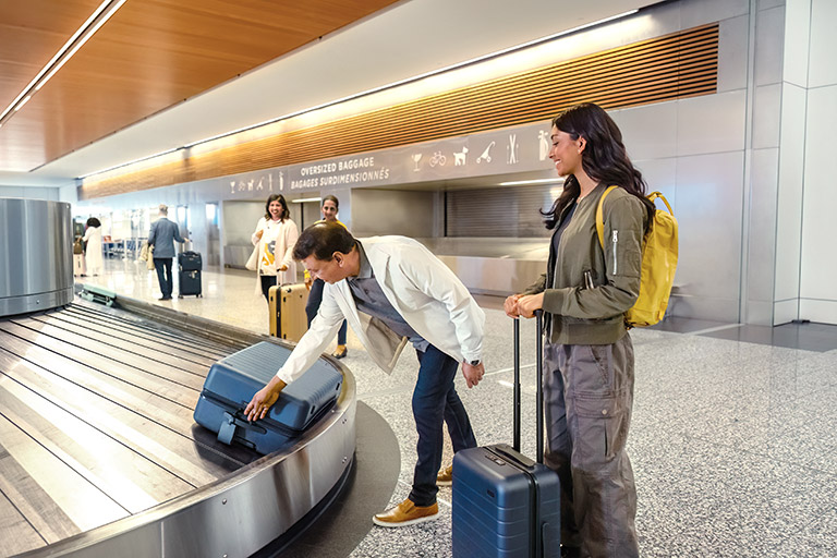 People collecting their luggage