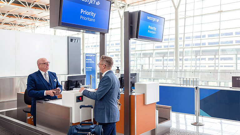 Guests at a priority boarding counter