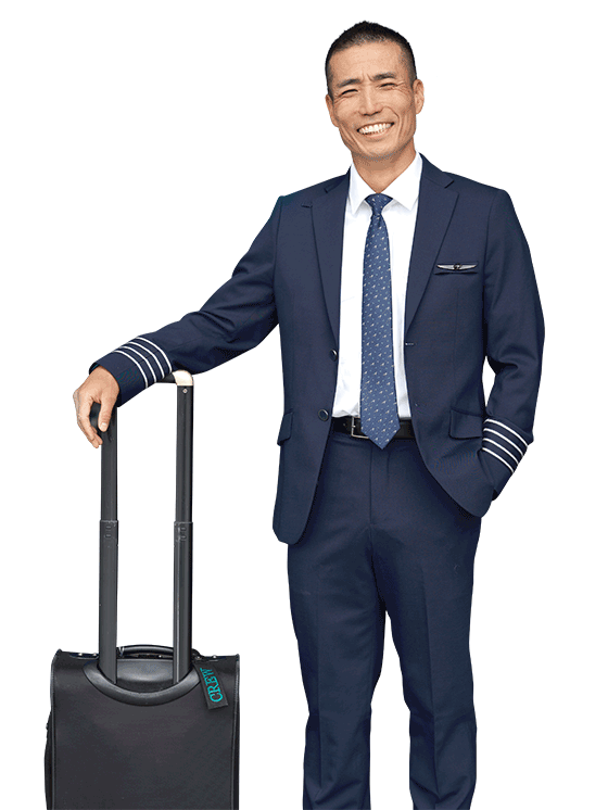 WestJet pilot with a travel suitcase
