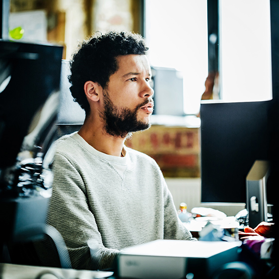 Contact Centre agent looking at computer screen