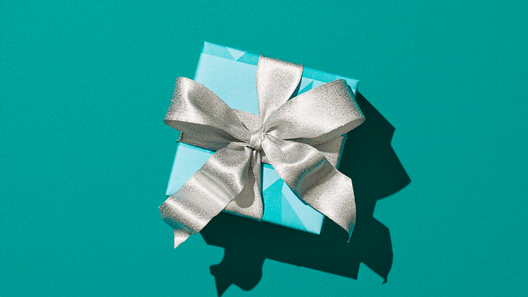 GIF of a gift with confetti