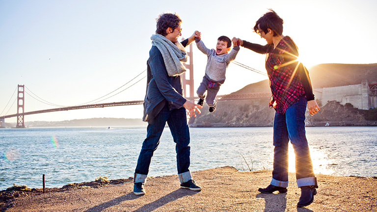 Family walking near the Golden Gate bridge in San Francisco