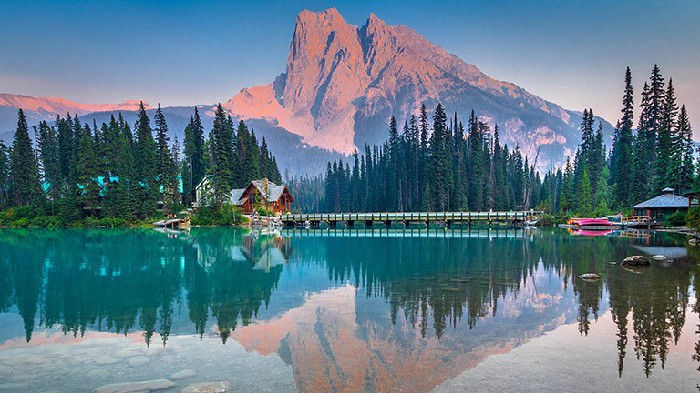 mountains reflecting on lake