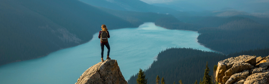 Girl overlooking a mountain lake