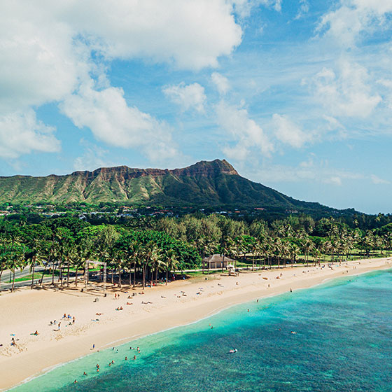 Hawaiian beach with mountains in the background