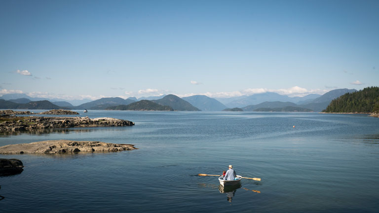 Kayakers admiring river and mountains