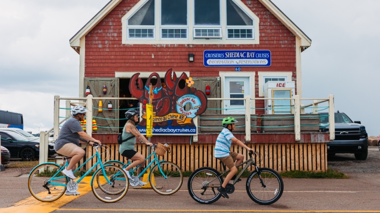 Family cycling in Shediac Bay