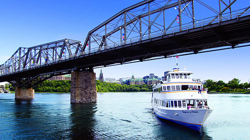 People enjoying a boat cruise down Ottawa River in the summer