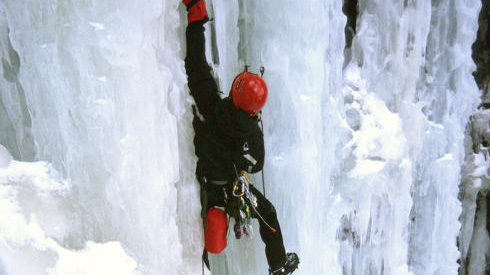 Ice climber climbing ice