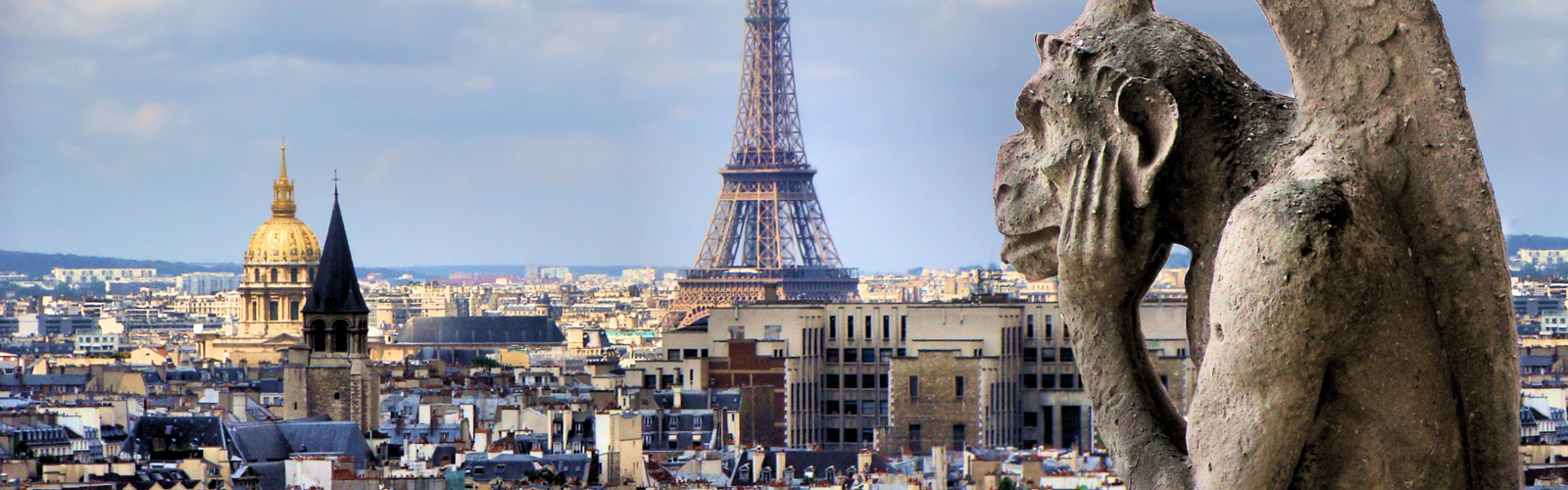 Notre dame gargoyle with Paris cityscape and Eiffel Tower