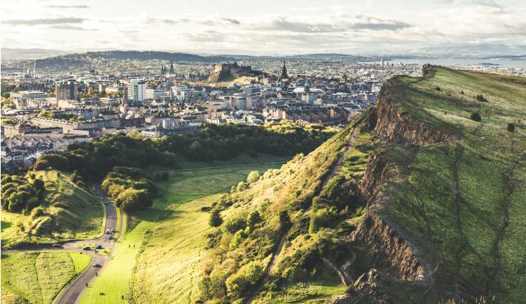 Cliffs at Holyrood Park with Edinburgh city the in background