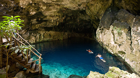 Cenotes with two snorkelers swimming in the Yucatán