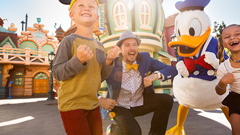 Donald and three guests dancing at Disneyland Resort in California