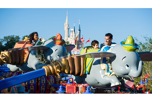Guests on Dumbo the Flying Elephant ride in Walt Disney World
