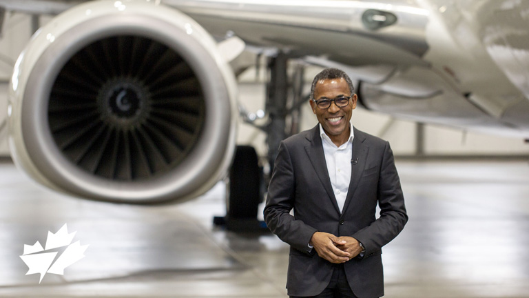 Billy Nolen, WestJets Vice-President, Safety, Security and Quality standing in front of aircraft