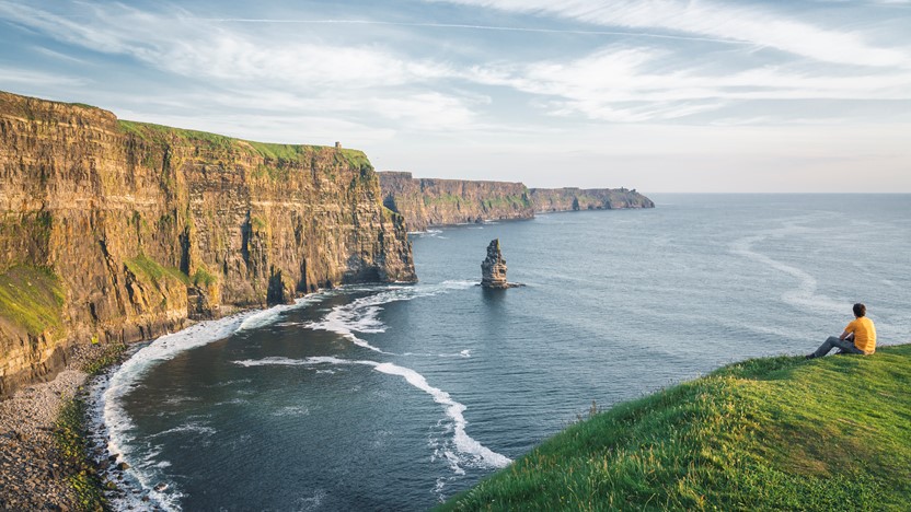 Guest sitting in Dublin on cliffs