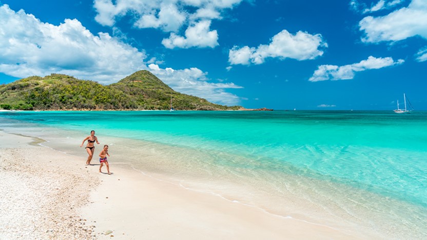 People walking on beach in Caribbean