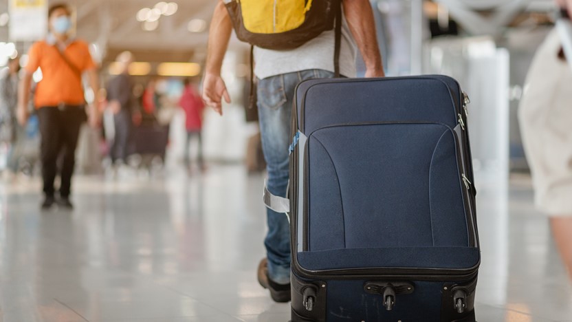 Guest walking with bag