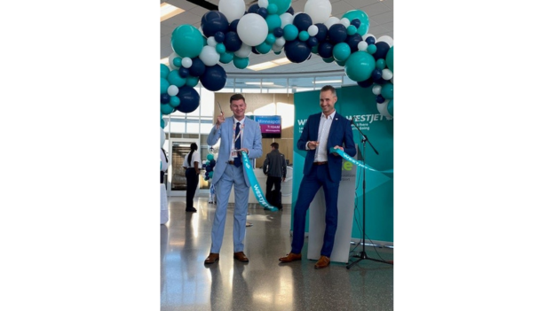 Jared Mikoch-Gerke, WestJet Director, Government Relations & Regulatory Affairs is joined by Stephen Maybury, President and CEO of Saskatoon Airport Authority at the inaugural flight between Saskatoon and Minneapolis. 