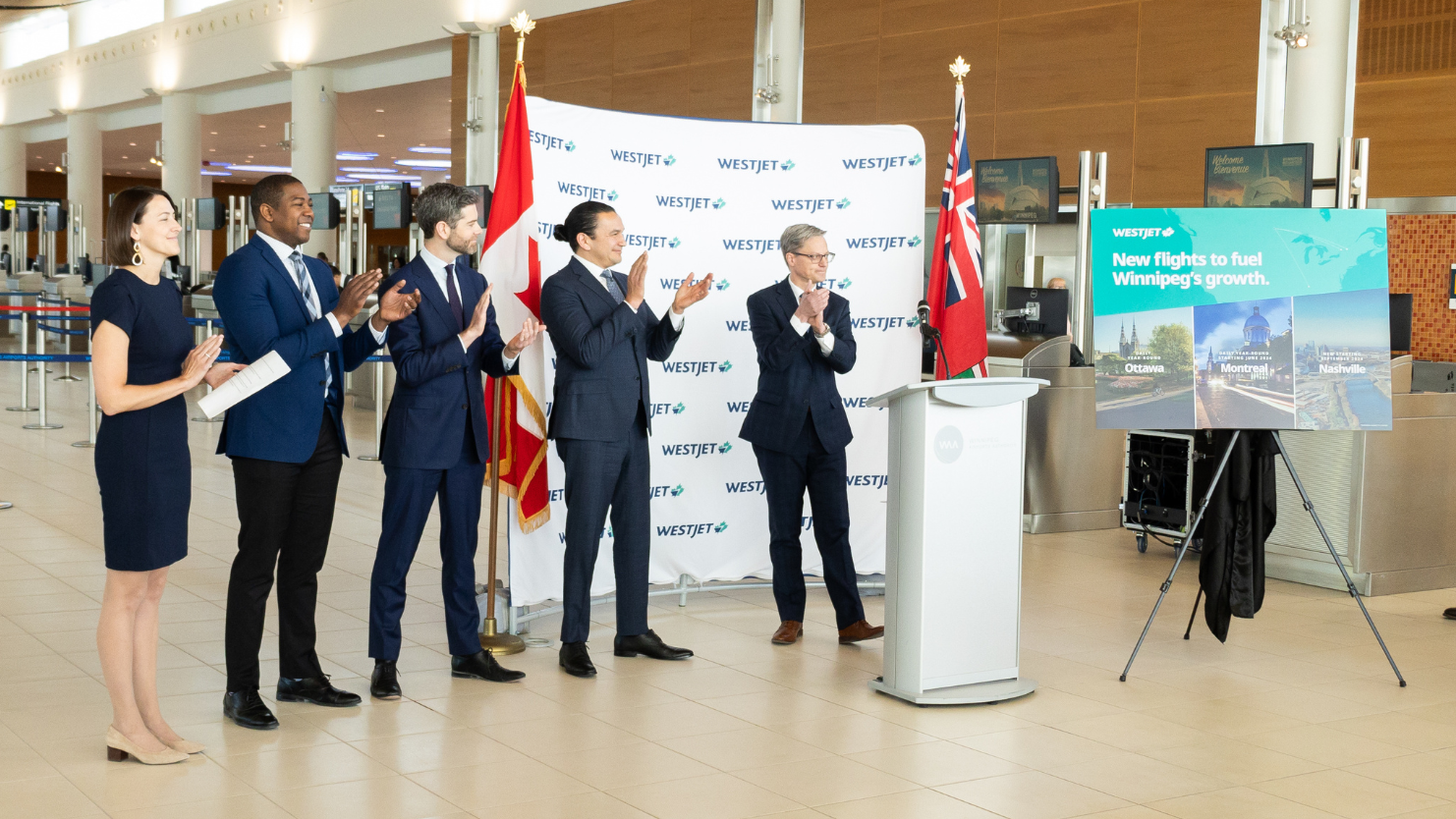 From left: Christina Iversen, WestJet, Director, External Affairs, Jamie Moses, Minister of Economic Development, Investment, Trade and Natural Resources of Manitoba, Nick Hays, President and CEO, Winnipeg Airports Authority., the Honourable Wab Kinew, Premier of Manitoba and Mike Scott, WestJet Group Executive Vice-President and Chief Financial Officer.
