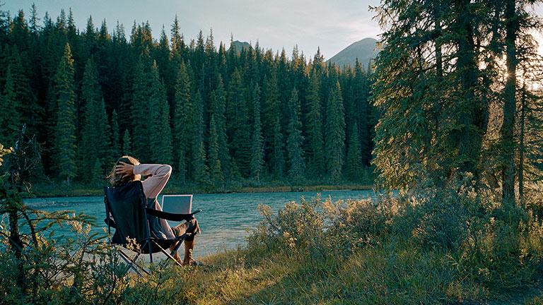 Person working remotely in the mountains