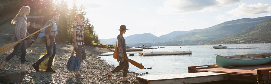 Friends walking to a dock 