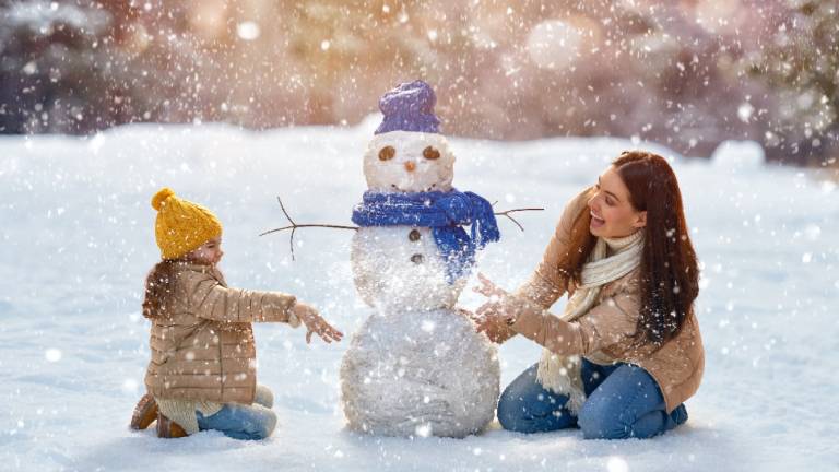 Mother and child with snowman  