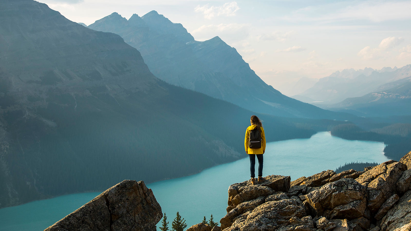 Hiker on a mountain; clear blue skies