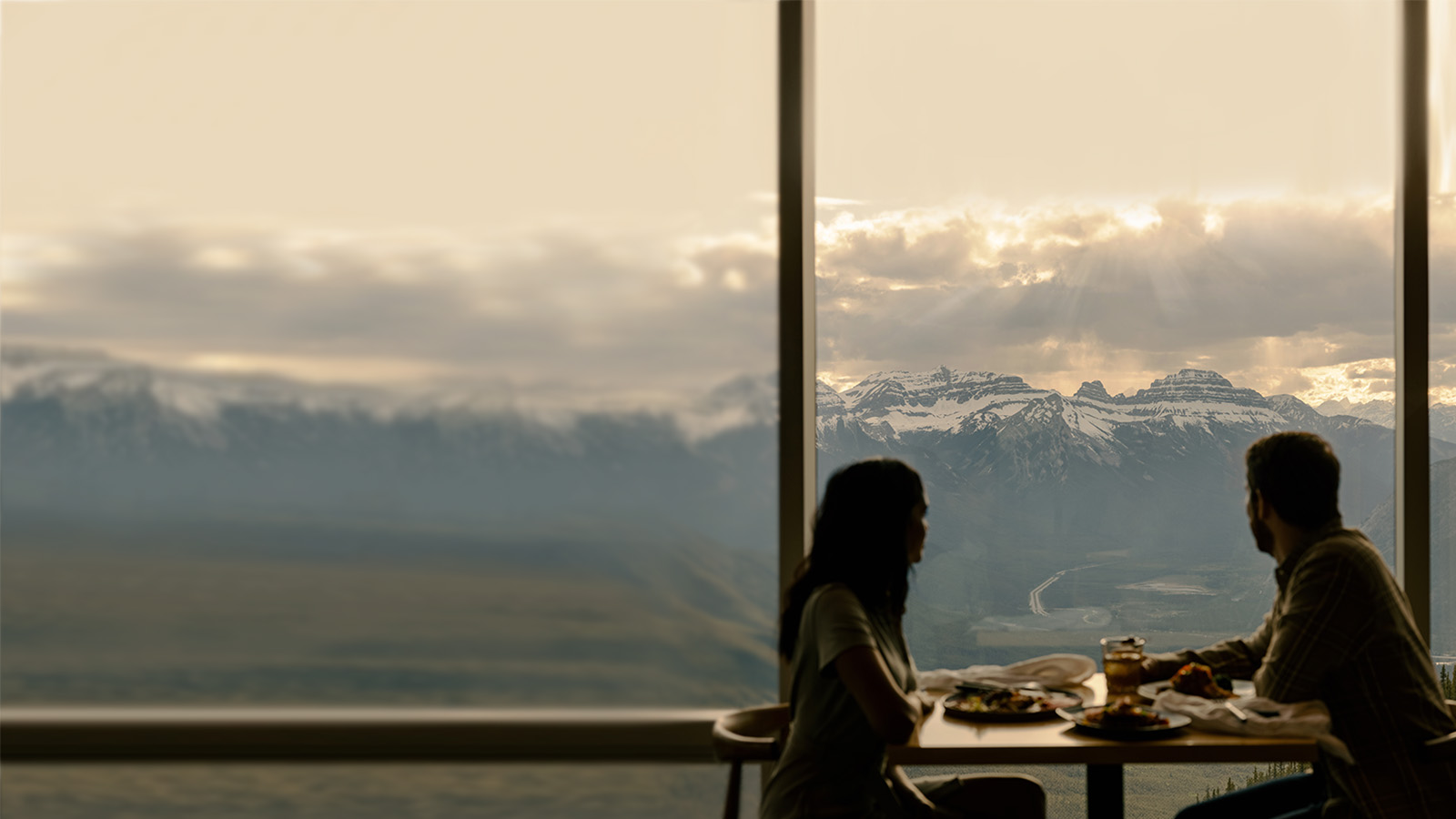 Couple eating in Sky Bistro with mountain view