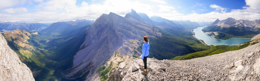 Woman standing on mountain top