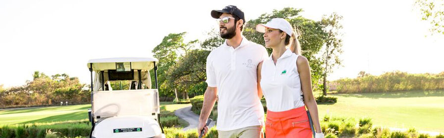 Couple golfing at Punta Blanca Golf Course in Punta Cana