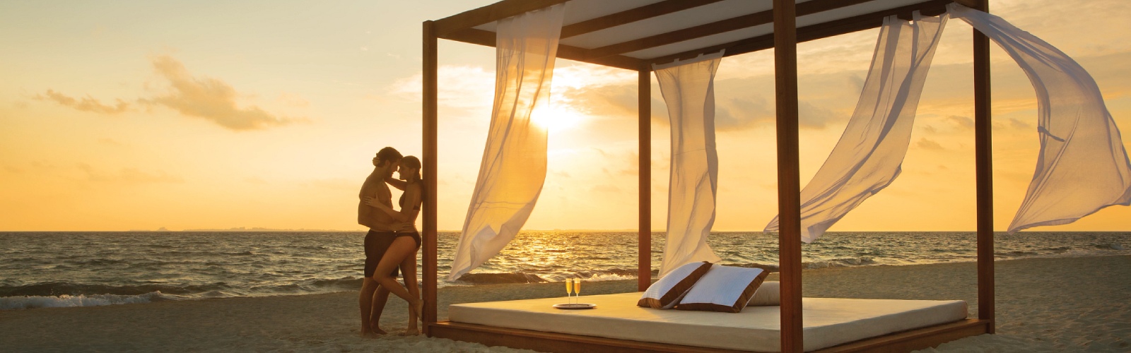 Couple embracing by beach bed