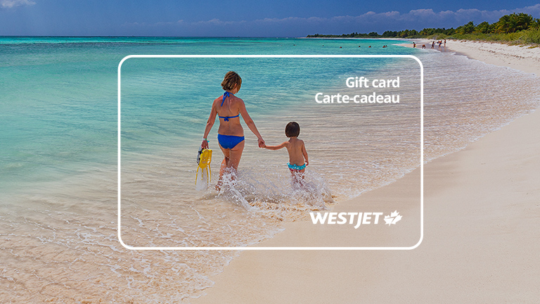 Parent and child on beach with WestJet holiday gift card overlay