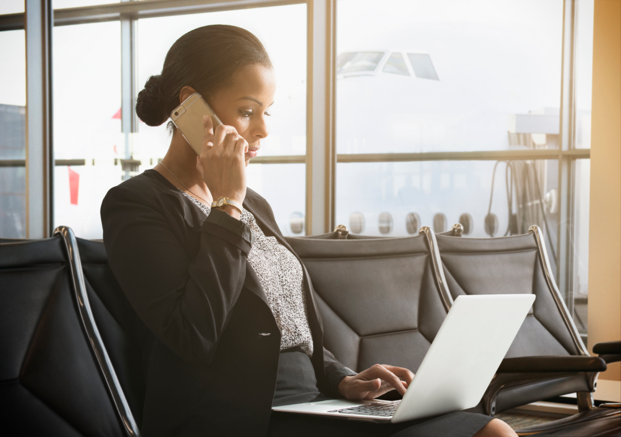 Businesswoman working in airport waiting area